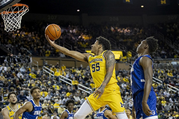 Brandon Johns Jr. (23) and Eli Brooks (55)