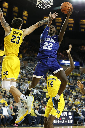Brandon Johns Jr. (23) and Moussa Diabate (14)