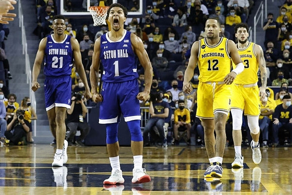 DeVante' Jones (12) and Brandon Johns Jr. (23)