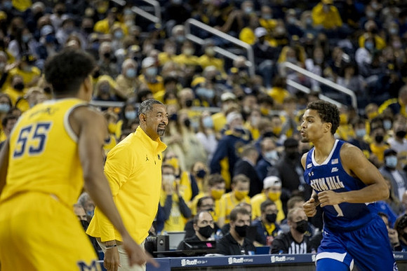 Eli Brooks (55) and Juwan Howard