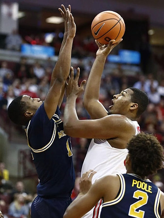 Muhammad-Ali Abdur-Rahkman (12) and Jordan Poole (2)