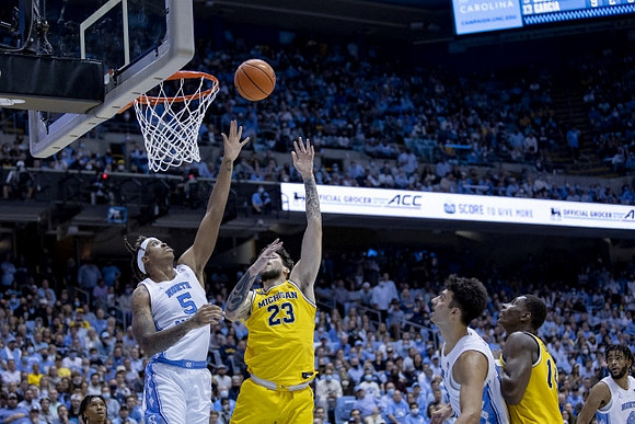 Brandon Johns Jr. (23) and Moussa Diabate (14)
