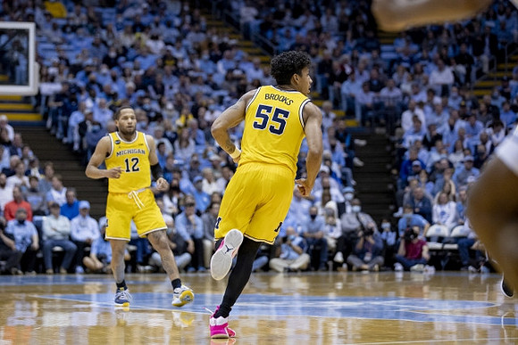 DeVante' Jones (12) and Eli Brooks (55)