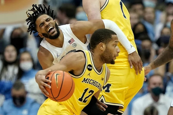 DeVante' Jones (12) and Hunter Dickinson (1)