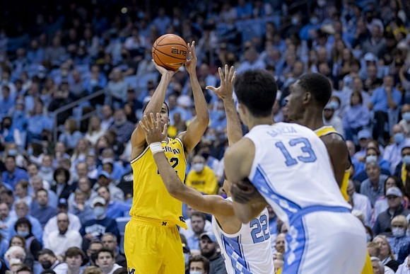 Caleb Houstan (22) and Moussa Diabate (14)
