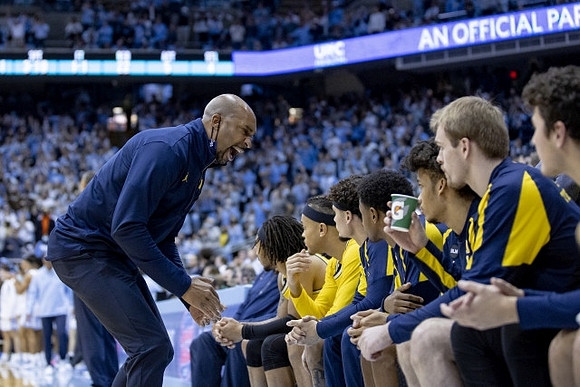 Saddi Washington and Michigan Team