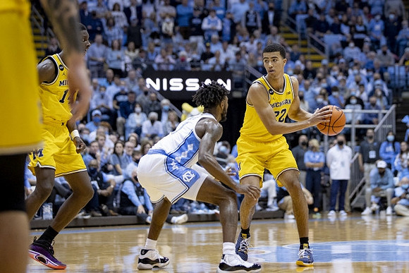 Moussa Diabate (14) and Caleb Houstan (22)