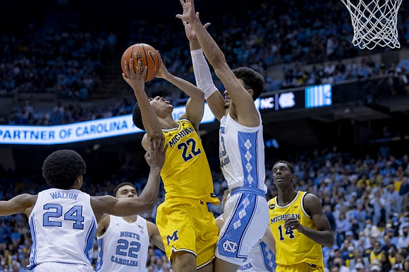Caleb Houstan (22) and Moussa Diabate (14)