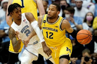 DeVante' Jones (12) and Hunter Dickinson (1)