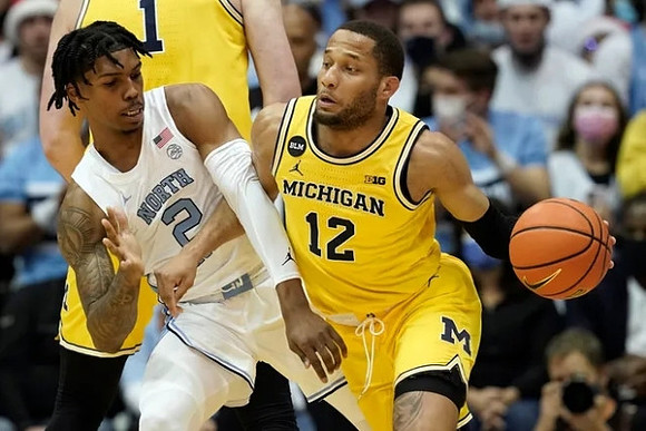 DeVante' Jones (12) and Hunter Dickinson (1)
