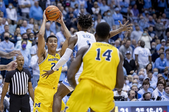 Caleb Houstan (22) and Moussa Diabate (14)