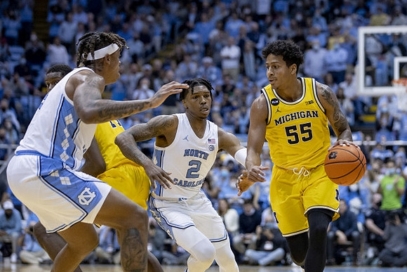 Moussa Diabate (14) and Eli Brooks (55)