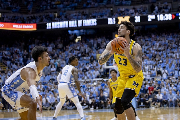 Brandon Johns Jr. (23) and Eli Brooks (55)