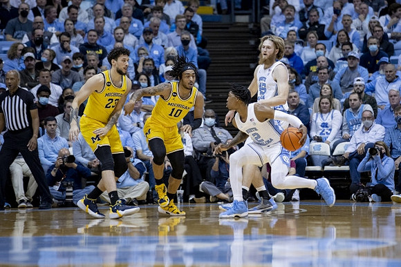 Brandon Johns Jr. (23) and Frankie Collins (10)