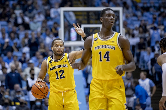 DeVante' Jones (12) and Moussa Diabate (14)