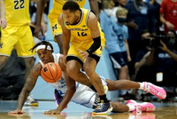 DeVante' Jones (12) and Caleb Houstan (22)