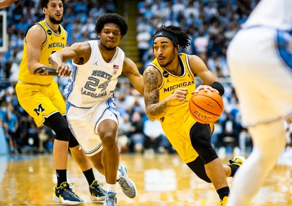 Brandon Johns Jr. (23) and Frankie Collins (10)