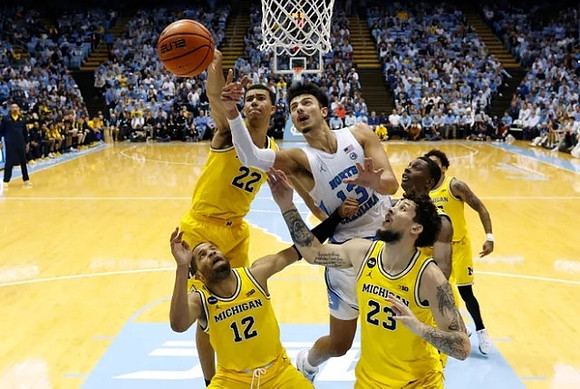 Caleb Houstan (22), DeVante' Jones (12), Brandon Johns Jr. (23), Moussa Diabate (14), and Eli Brooks (55)