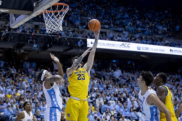 Brandon Johns Jr. (23) and Moussa Diabate (14)