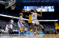 Hunter Dickinson (1) and Moussa Diabate (14)