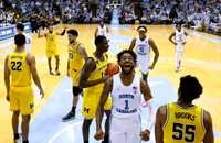 Caleb Houstan (22), DeVante' Jones (12), Brandon Johns Jr. (23), Moussa Diabate (14), and Eli Brooks (55)
