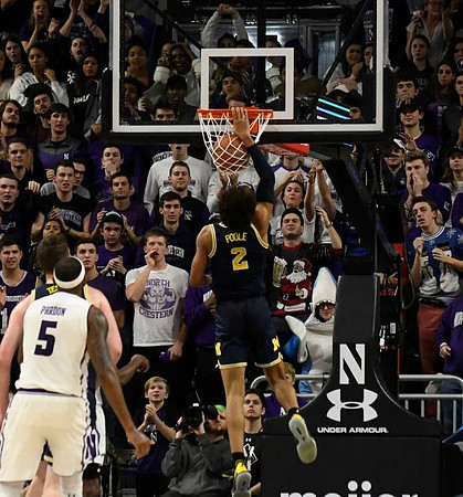 Jon Teske (15) and Jordan Poole (2)