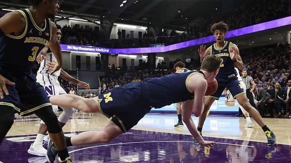 Zavier Simpson (3), Jon Teske (15), and Jordan Poole (2)