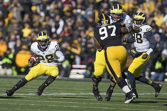 Fitzgerald Toussaint (28) and Devin Gardner (98)