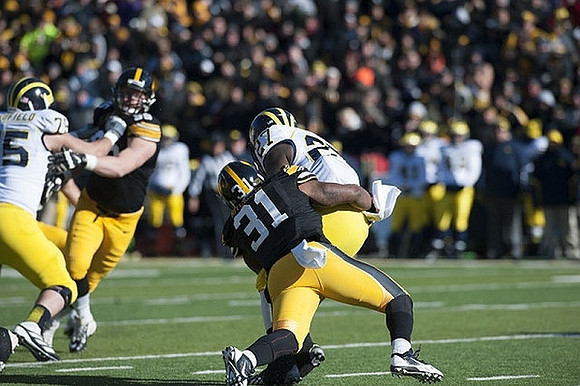 Michael Schofield (75) and Derrick Green (27)