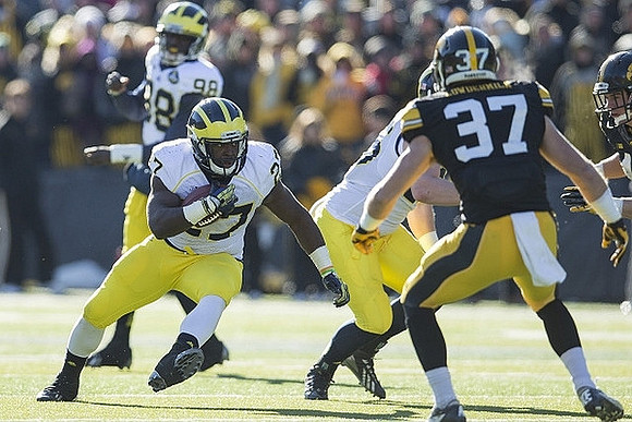 Devin Gardner (98) and Derrick Green (27)