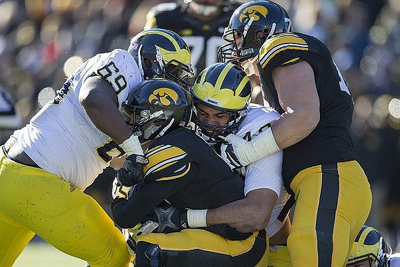Willie Henry (69) and Chris Wormley (43)