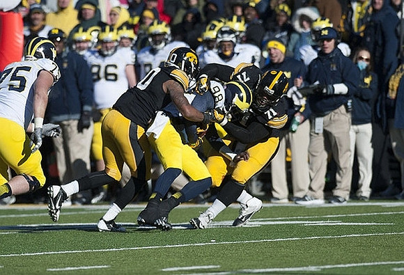 Michael Schofield (75) and Devin Gardner (98)