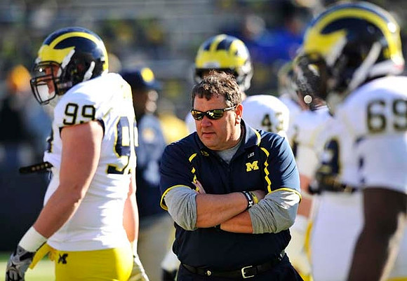 Matthew Godin (99), Brady Hoke, Matt Wile (45), and Willie Henry (69)