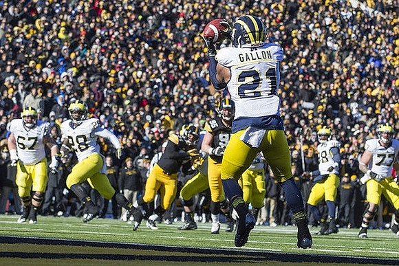 Jeremy Gallon (21), Kyle Kalis (67), Fitzgerald Toussaint (28), Fitzgerald Toussaint (28), and Taylor Lewan (77)
