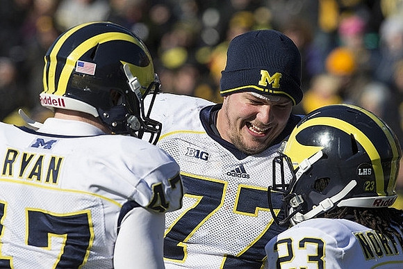 Jake Ryan (47), Taylor Lewan (77), and Dennis Norfleet (23)