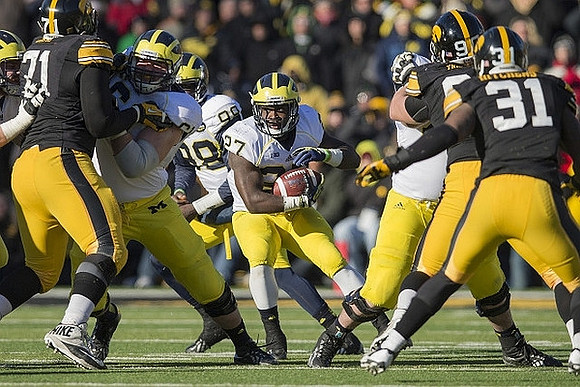 Devin Gardner (98) and Derrick Green (27)