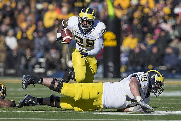 Fitzgerald Toussaint (28) and Erik Magnuson (78)