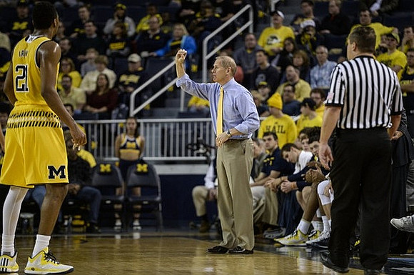 Zak Irvin (21) and John Beilein