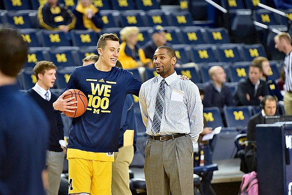 Spike Albrecht (2), Duncan Robinson (22), and LaVall Jordan