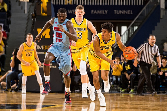 Duncan Robinson (22), Moritz Wagner (13), and Aubrey Dawkins (24)