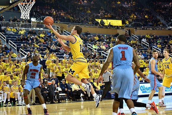 Andrew Dakich (11) and Mark Donnal (34)
