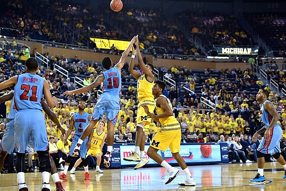 Andrew Dakich (11), Kameron Chatman (3), and Aubrey Dawkins (24)