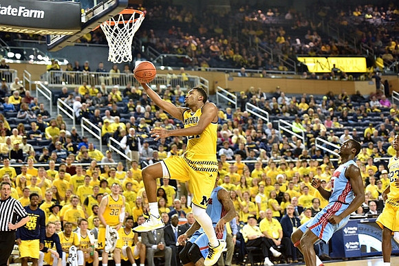 Zak Irvin (21) and Caris LeVert (23)