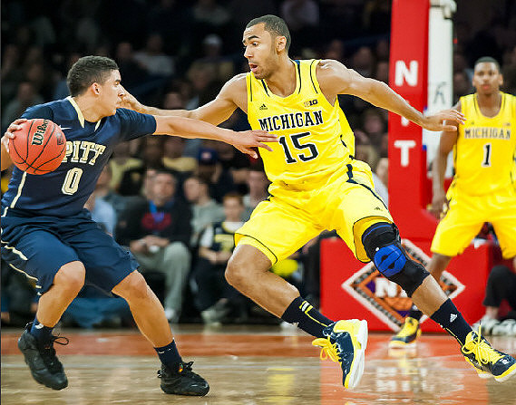 Jon Horford (15) and Glenn Robinson III (1)