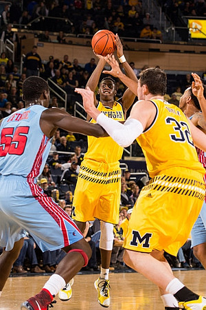 Caris LeVert (23) and Ricky Doyle (32)