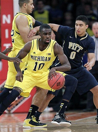 Jordan Morgan (52) and Tim Hardaway Jr. (10)