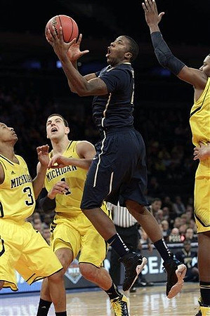 Trey Burke (3) and Glenn Robinson III (1)