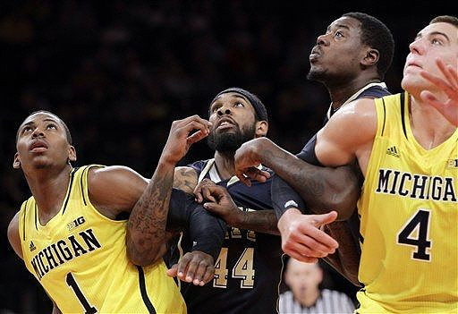 Glenn Robinson III (1) and Mitch McGary (4)