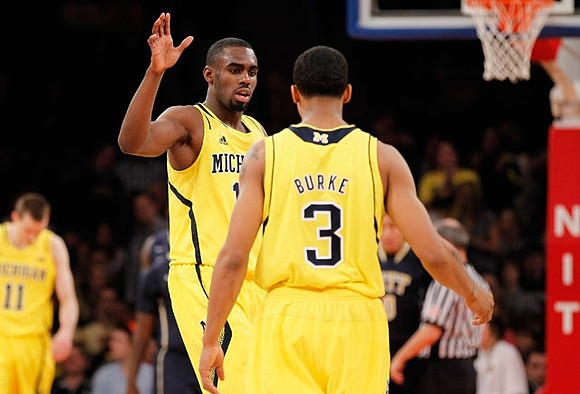 Nik Stauskas (11), Glenn Robinson III (1), and Trey Burke (3)