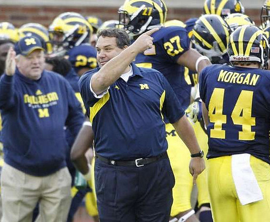 Floyd Simmons (23), Brady Hoke, Mike Jones (27), and Desmond Morgan (44)
